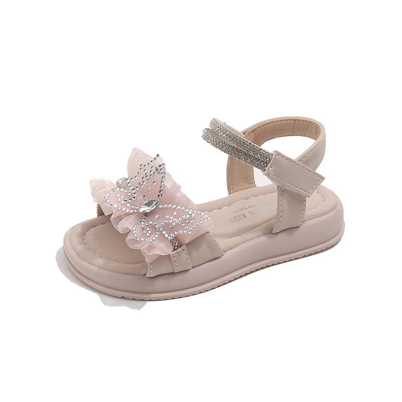 Niñas sandalias de dedos abiertos orificios 2026 verano nuevo estilo de moda para niños zapatos de playa versátiles mariposa diamante zapatos princesa