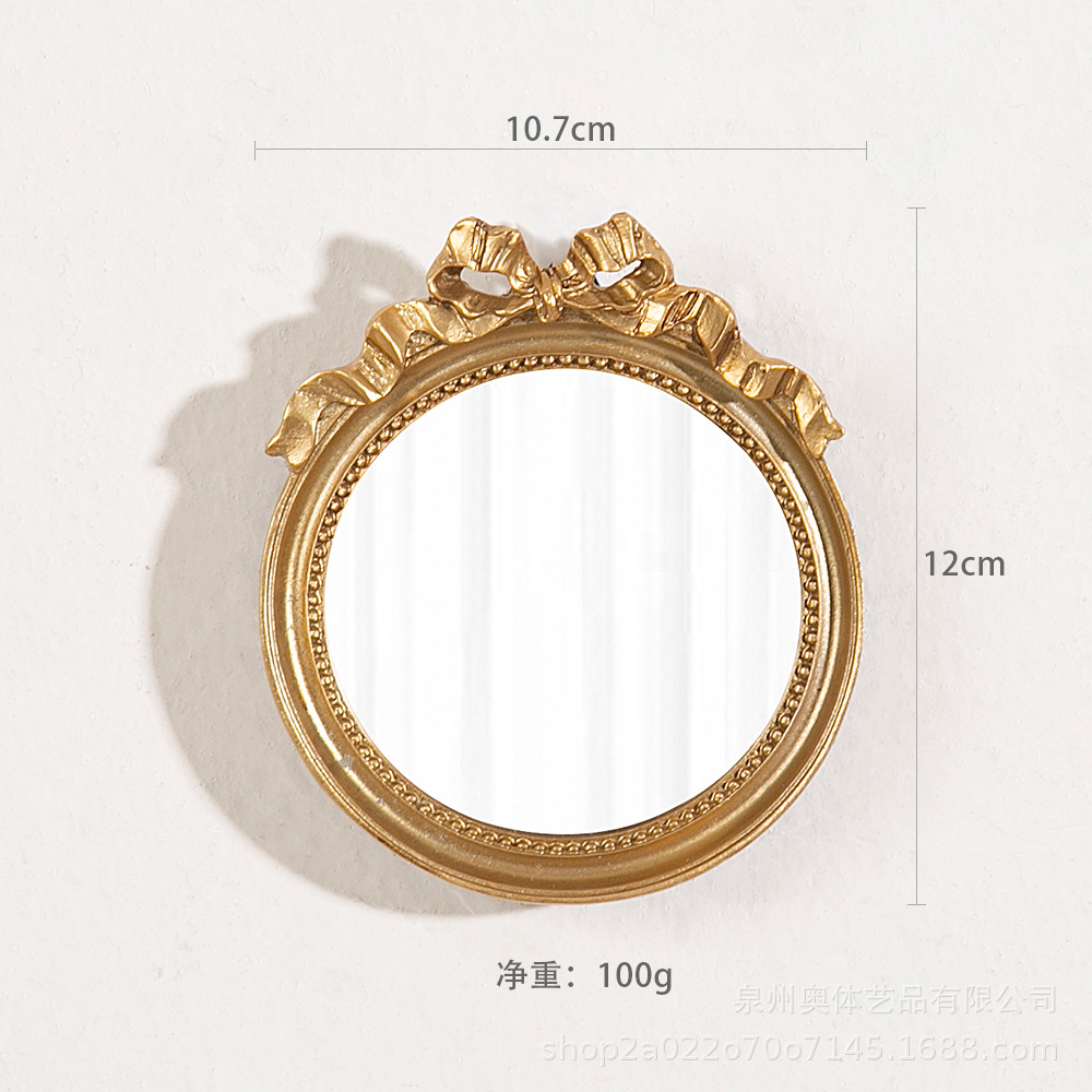 Small round mirror with bow