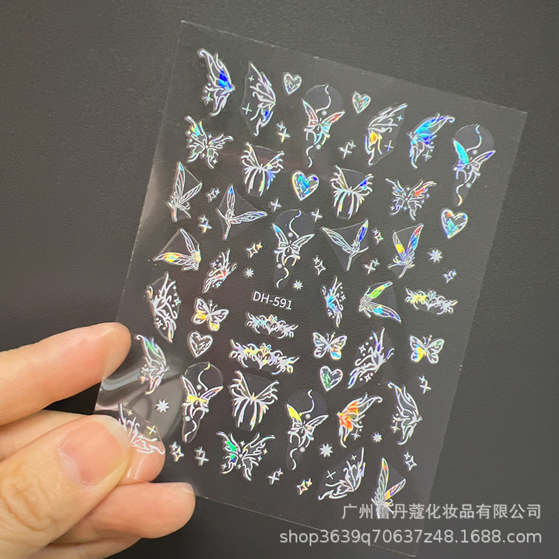 爆発的なネイルシールの上品な半透明な白い花びらの蝶のカラフルなオーロラガラスの破片には、ゴムの爪がついています|undefined