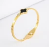 Golden bracelet, four-leaf clover