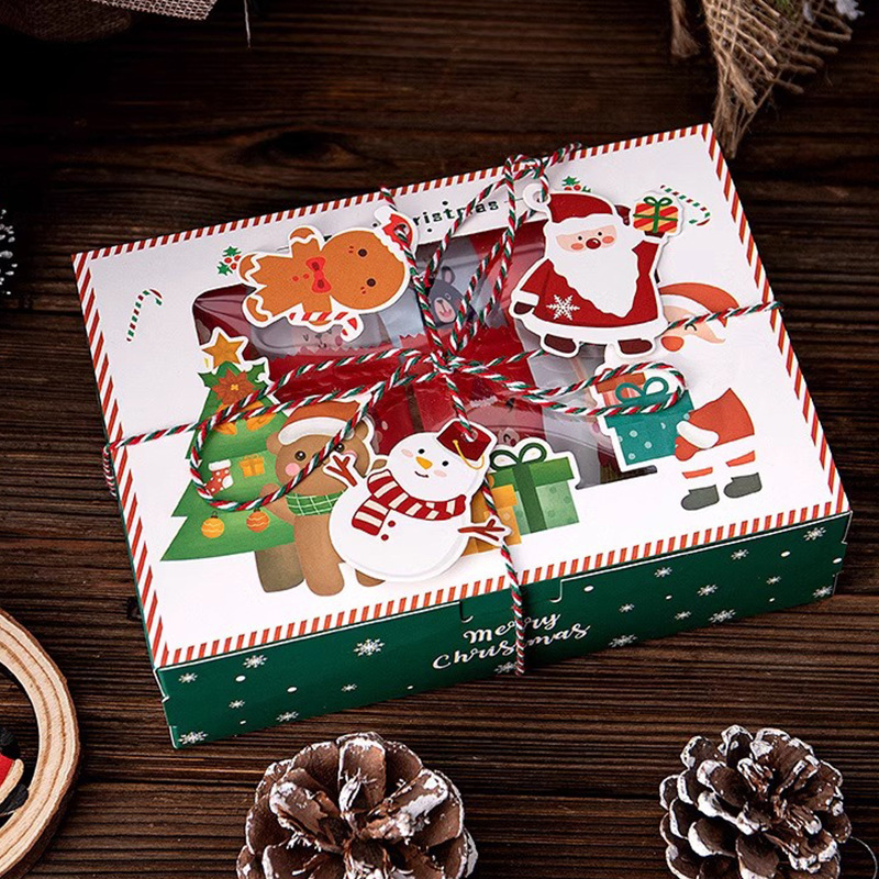 新商品の透明な窓の開けたクリスマスのプレゼントの箱はふたを開けてデザートのビスケットの包装箱のカラー印の卵のタルトのパンの白い紙の箱を覆います。|undefined