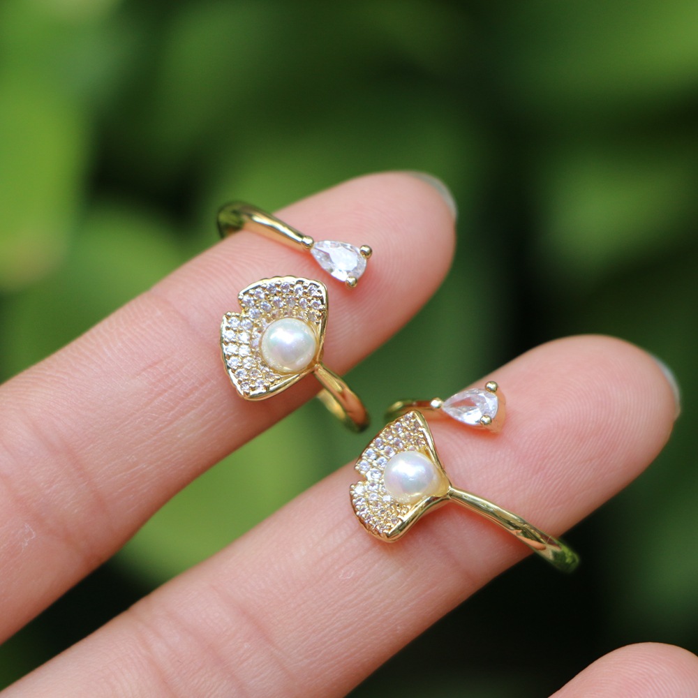 Fashion Micro-encrusted Zircon Pearl Copper Female Simple Opening Creative Ring display picture 1