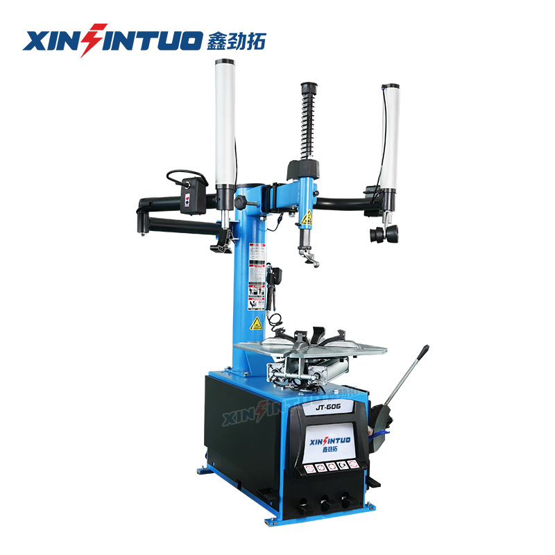 Desmontadora de neumáticos totalmente automática Jintuo, máquina desmontadora de neumáticos potente a prueba de explosiones con brazos auxiliares duales y sistema neumático.