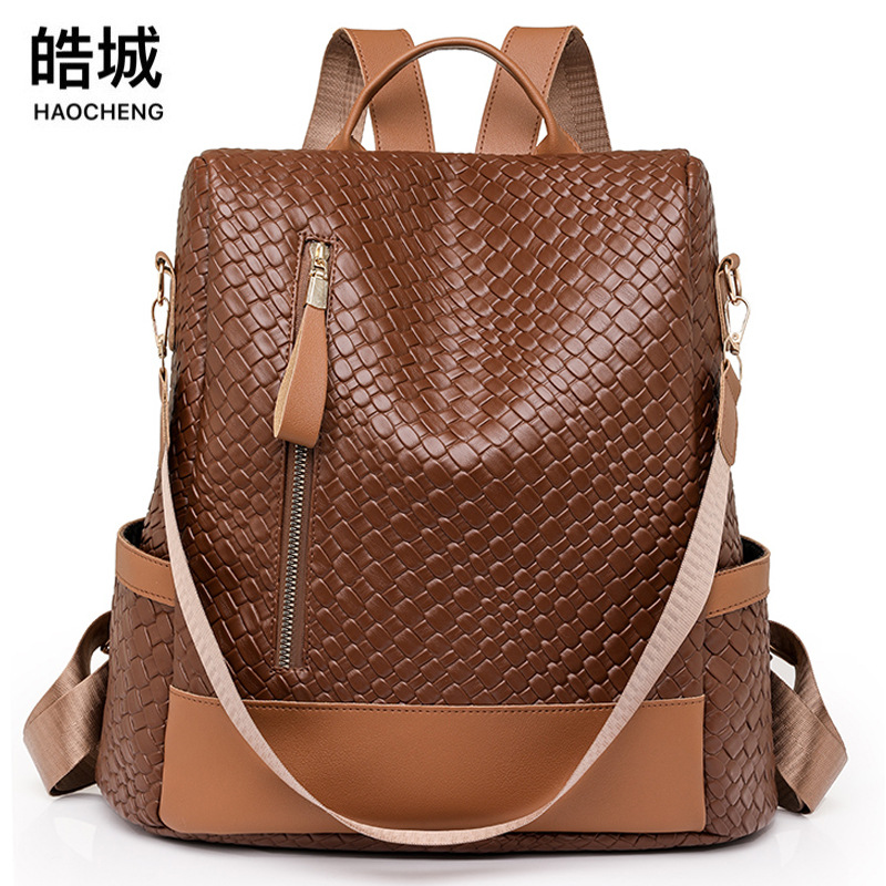 Comercio exterior al por mayor 2024 nuevas señoras casuales de cuero suave mochila antirrobo moda tejida multifunción mochila de doble uso