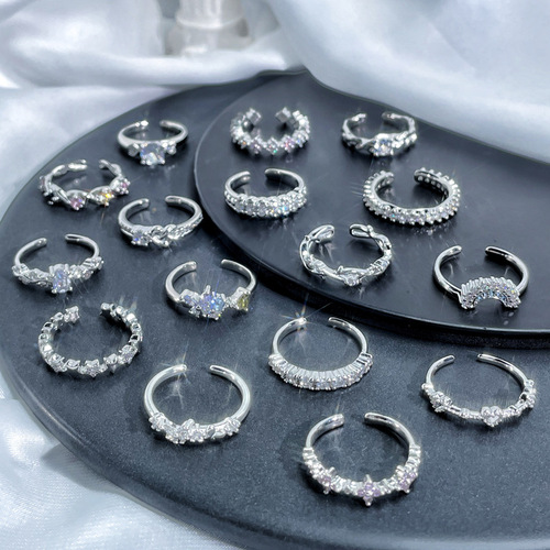 Delicate and small, minimalist open-mouthed ring with embedded zircons, unisex design, stackable and versatile fashion ring with a cool and indifferent style.