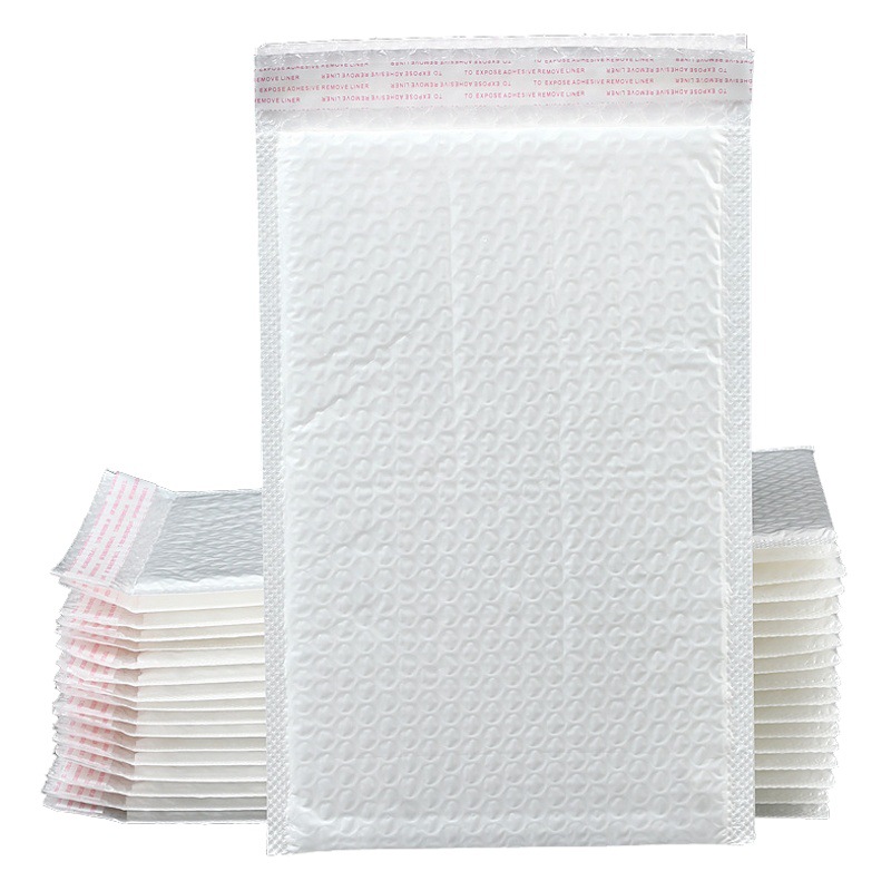 Bolsa de burbuja de película nacarada compuesta bolsa de envoltura engrosada de cuatro capas libro de ropa bolsa de espuma de embalaje expreso al por mayor
