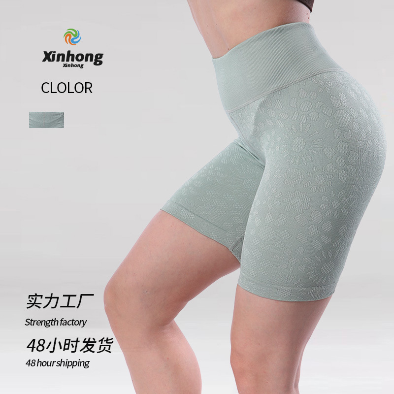 Pantalones cortos de fitness de cadera de melocotón europeos y americanos pantalones de cinco puntos deportivos ajustados con estampado de mujer pantalones cortos de yoga de cintura alta sin costuras