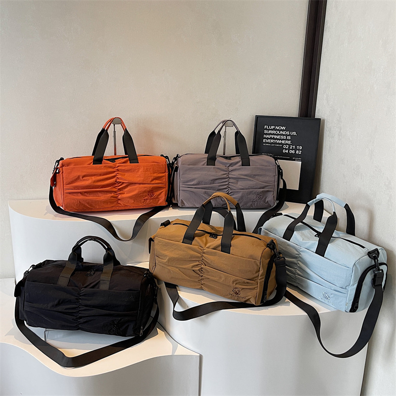 Nueva bolsa de viaje para mujeres, bolsa de fitness ligera, bolsa de yoga deportiva de moda, bolsa de mano secada y húmeda.