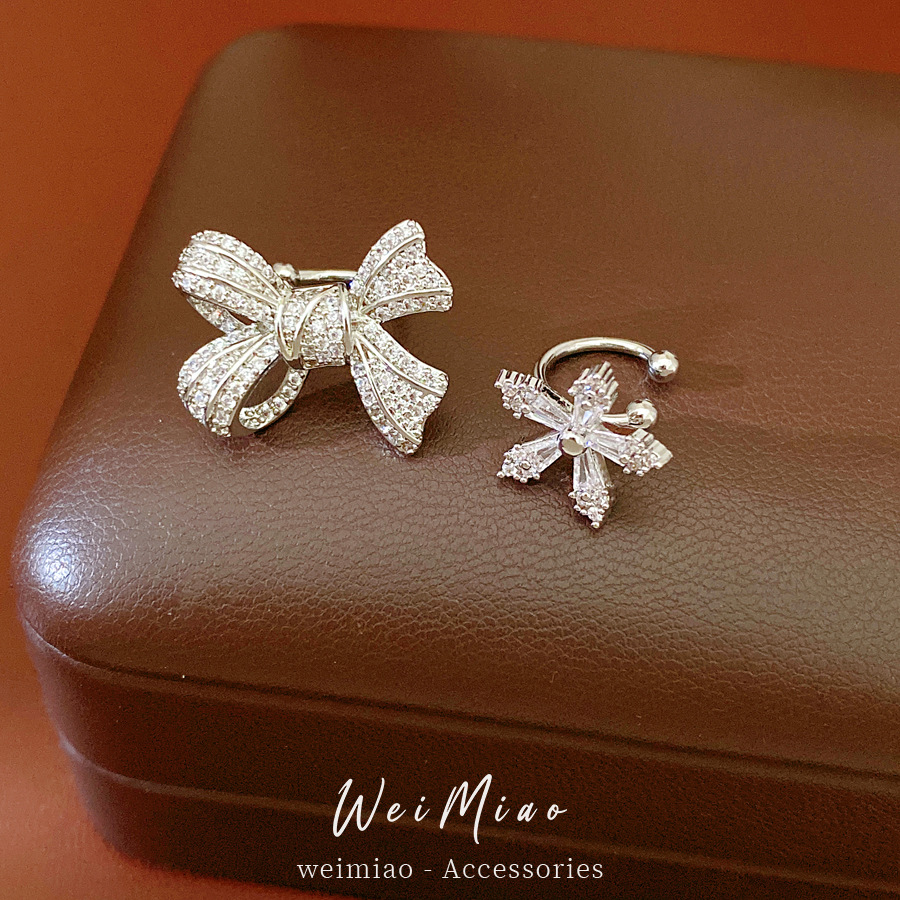 Flores de zircon arco de orejas de orejas mujeres sin agujeros de orejas personalidad temperamento de moda pendientes ligeros de lujo alta sensación de auriculares al por mayor