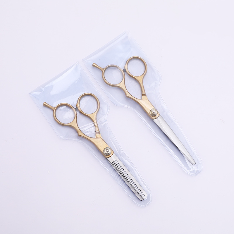 Suministro directo de fábrica Tijeras divididas de oro Tijeras de peluquería Tijeras en stock