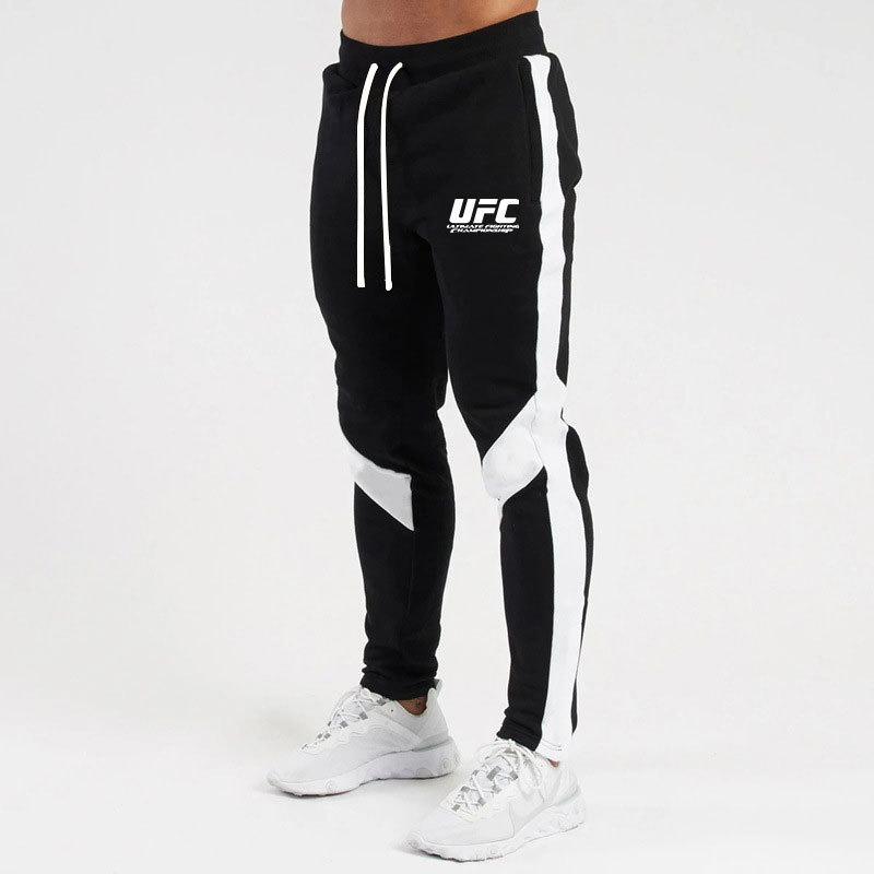 Otoño e invierno letras deportivas juventud ordinaria media elástica Mediados de cintura pantalones de algodón negro en stock moda de lana pantalones de los hombres