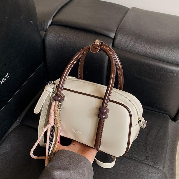 Colores contrastantes de tendencia universal bolso de bolos de mano mujer 2025 nuevo estilo de alto nivel de moda casual mochila de hombro