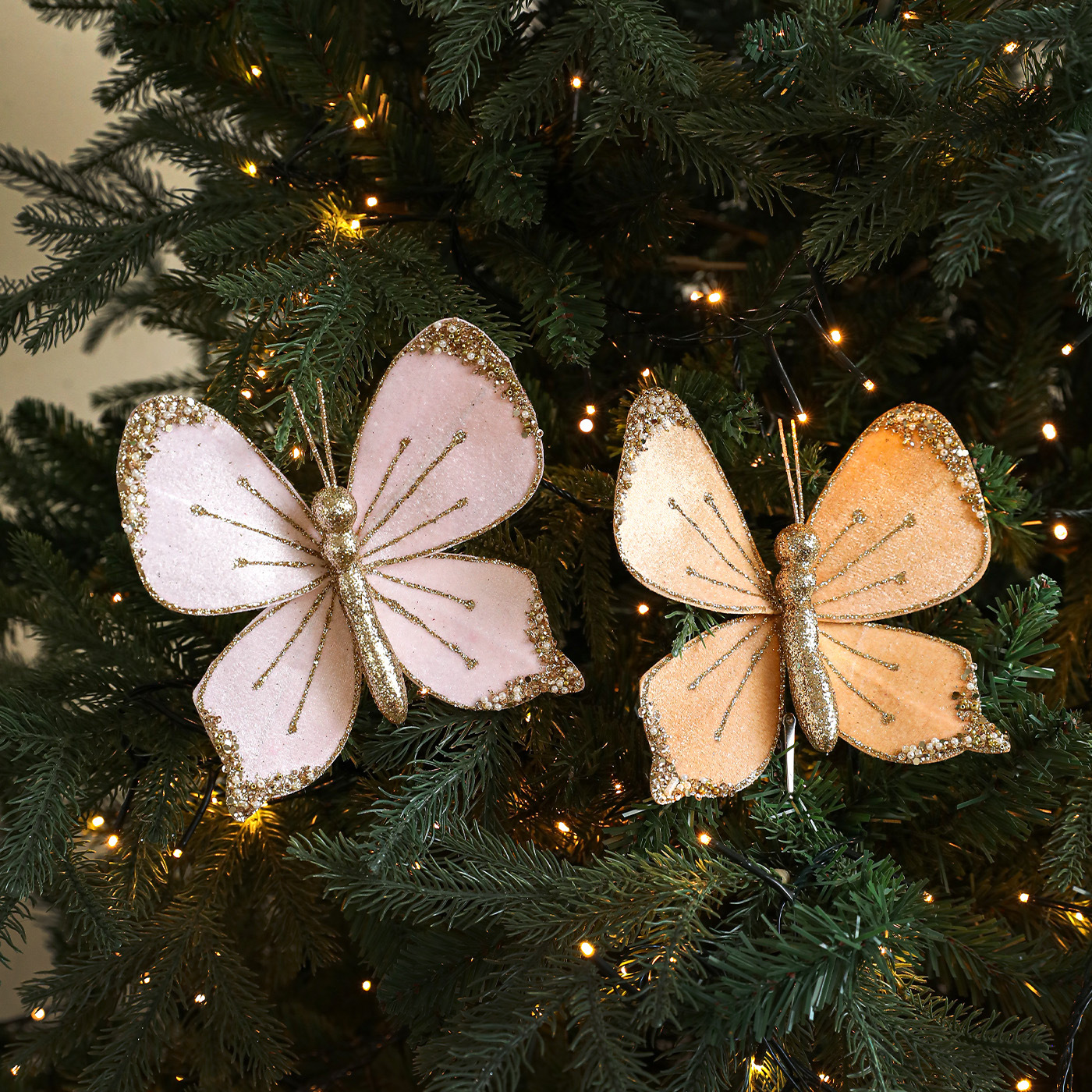 Nuevos productos de tela de alta calidad simulación de clip de arco de mariposa tela de vello polvo flocado árbol de Navidad decoración colgante diseño de escena