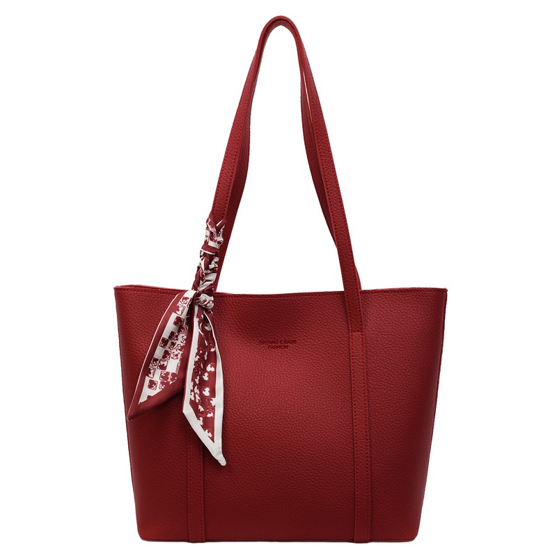 Bolso rojo de gran capacidad para mujeres versátil 2025 nuevo bolso de hombro casual simple para trabajar bolso de viaje