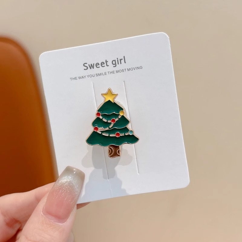 Broche de aleación de sentido avanzado japonés nueva insignia de personalidad de moda femenina de dibujos animados bolsa de Navidad accesorios de metal al por mayor