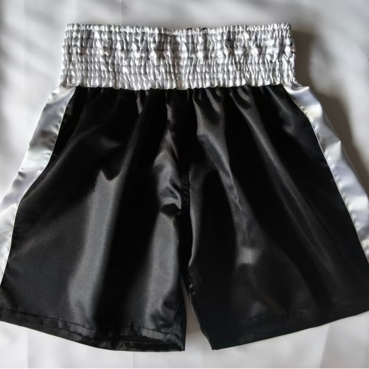 New boxing shorts available in four colors, lightweight, breathable, loose fit, customizable, and available for dropshipping