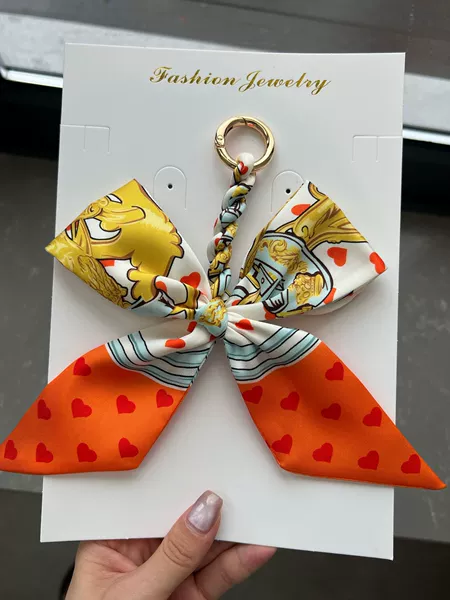 Orange love bow hanging ornament