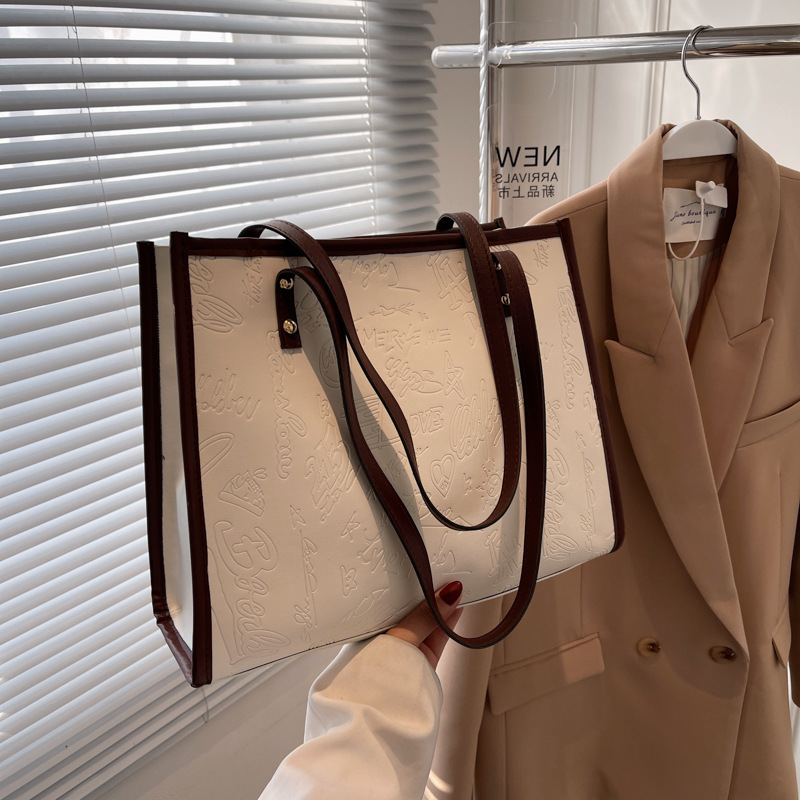 Bolso de mujer 2024 primavera nuevo nicho lienzo de cuatro hojas de gran capacidad bolso de hombro simple bolso de todo tipo