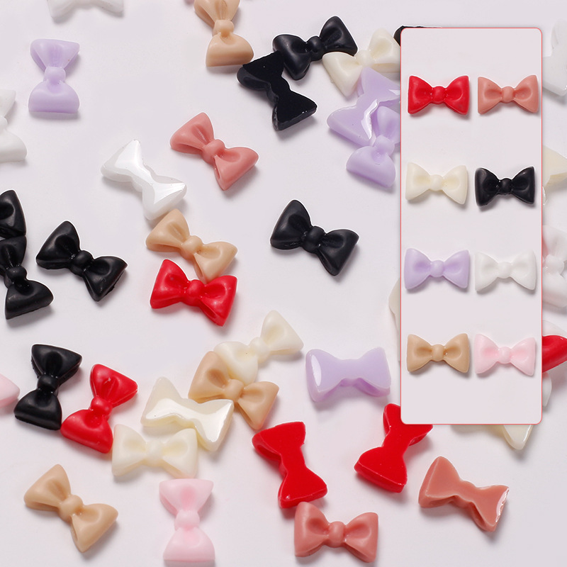 Joyas de arco de uñas al por mayor en línea explosión simple de resina joyas de uñas estereoscópicas flotantes mezcladas 50