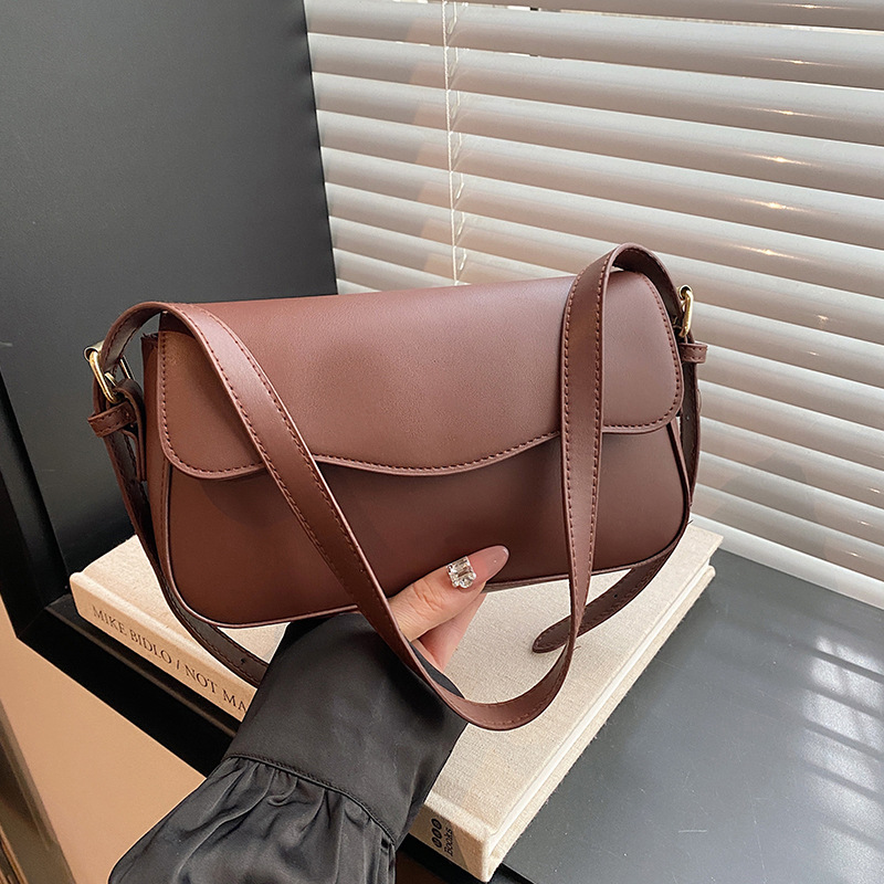 Bolsa de hombro de temperamento para mujeres 2024 otoño nuevo estilo de moda textura mochila de diseño artístico simple bolso de brazo