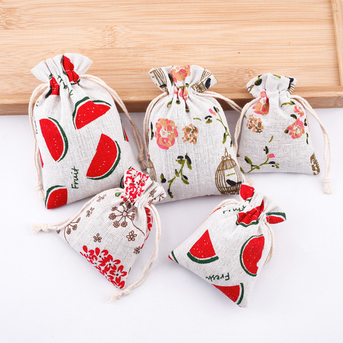 Wholesale manufacturer-printed cotton bags—cartoon drawstring pouches, jewelry and gift bags, mosquito-repellent empty bags, small cotton-linen pouches.