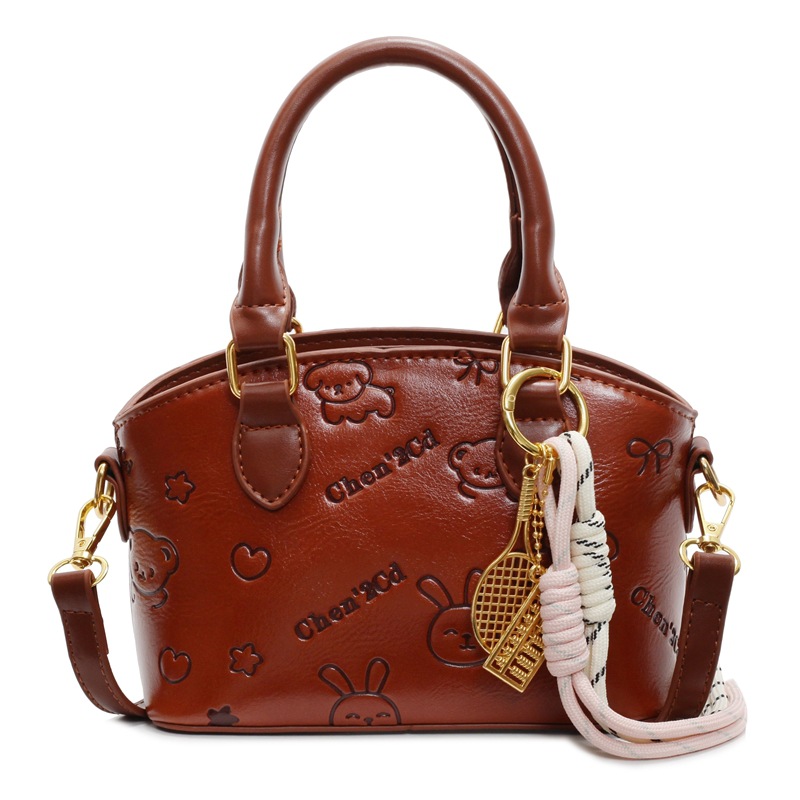 Tendencia nicho bolso de mano de moda mujer 2025 nueva textura versátil bolso de cubo bolso de transporte aéreo