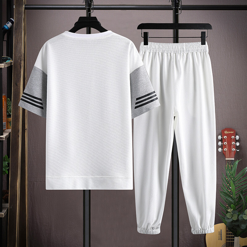 Una pieza de generación de cabello traje de moda de estilo caliente de verano para hombres, camiseta de manga corta de tendencia para hombres, pantalones casuales, traje de dos piezas