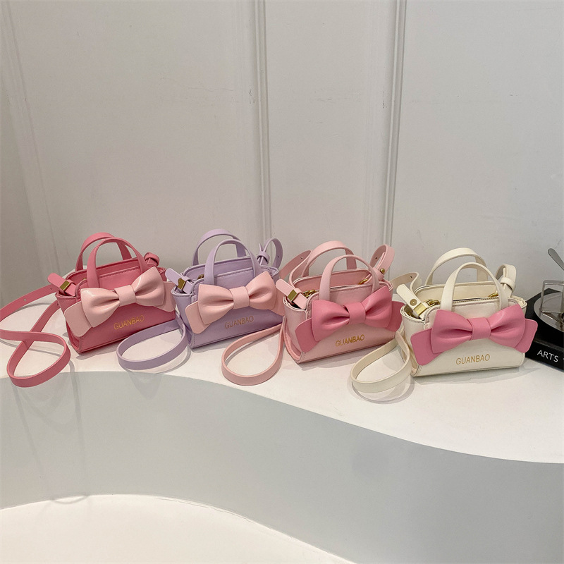 Nuevo tipo de bolso de hombro para niños y niñas, estilo coreano de moda, bolso de arco para niños 2024, bolso mini de estilo extranjero