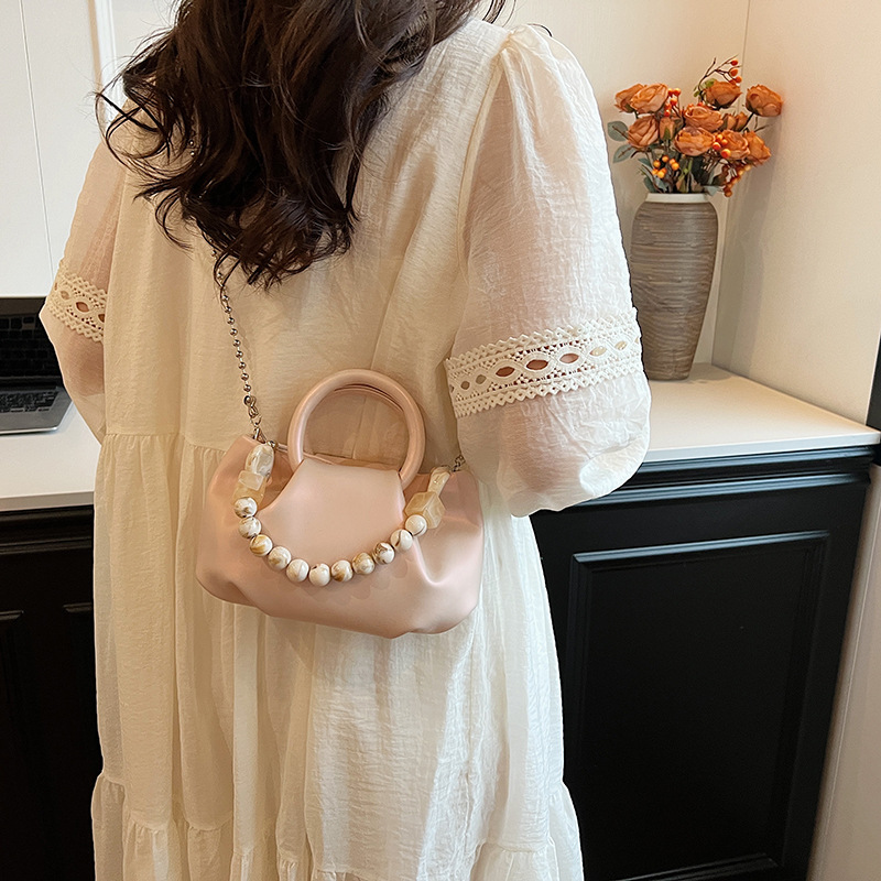 High end handbag for women in 2024, new niche design, summer handheld pleated chain strap, crossbody cloud bag_voghion.com
