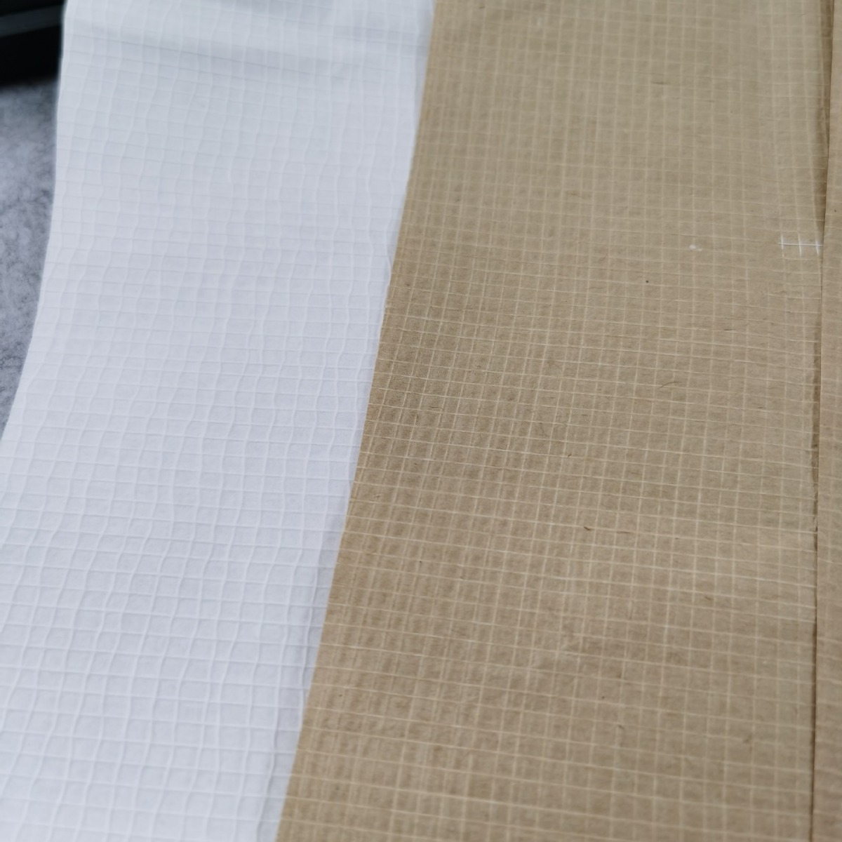 带线牛皮纸夹线纸常用于包装大型重型物品如机械零件、建筑材料等