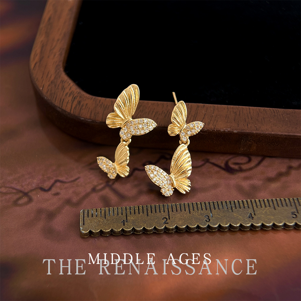 Vintage ligero estilo medio antiguo ligero circonio de lujo ligero aretes de mariposa doble estilo artístico francés retro aretes de alta gama mujeres