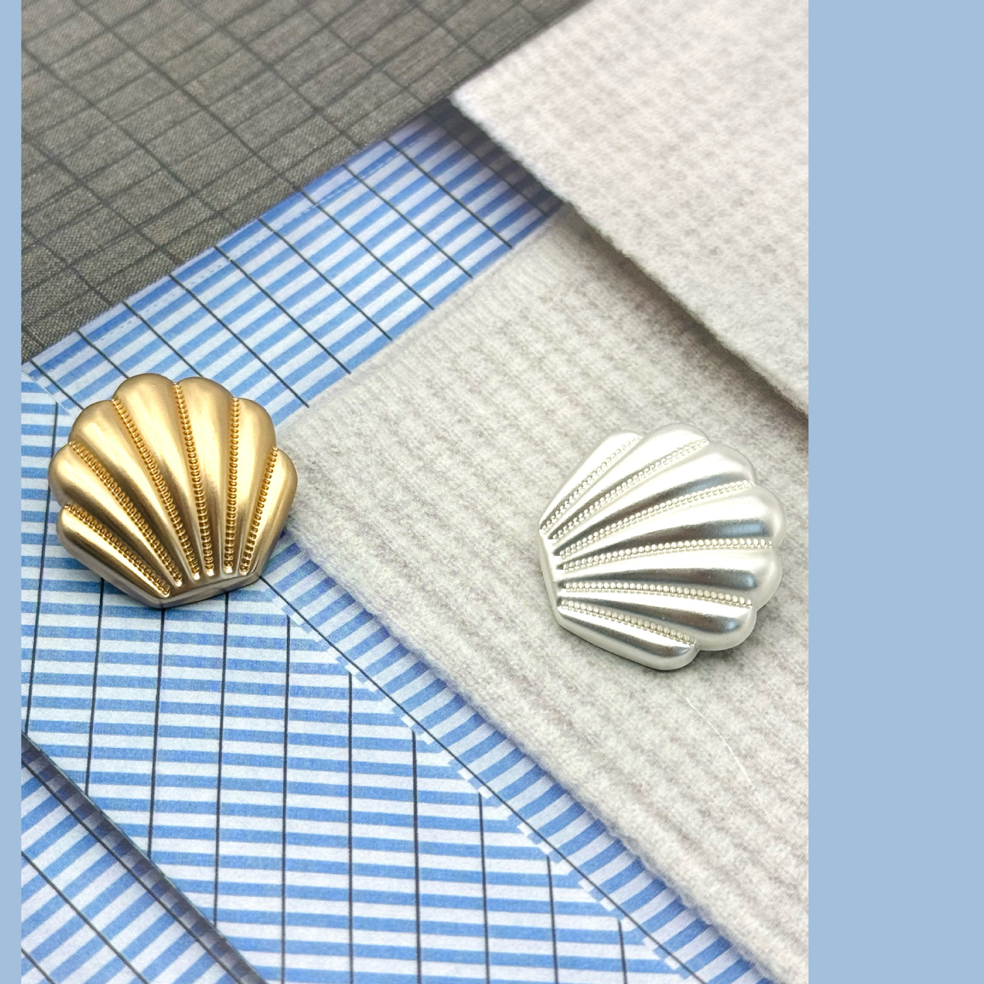 Scalloped shell metal buttons
