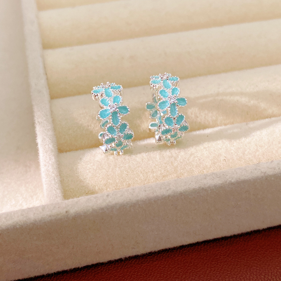 Dopamina color zircón goteo flor aretes redondos frescos aretes dulces lujosos alta sensación auriculares al por mayor