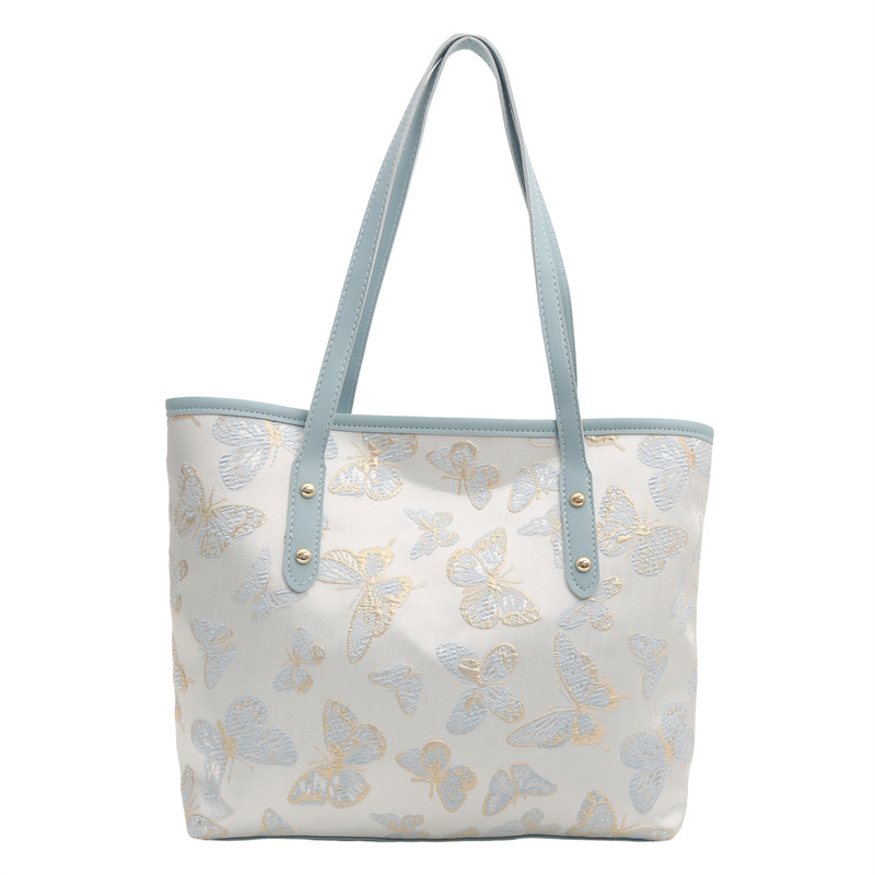 Nueva primavera y verano, nueva bolsa china de gran capacidad, estilo nacional de mariposa bordada bolsa de cubo, bolsa de hombro casual versátil.