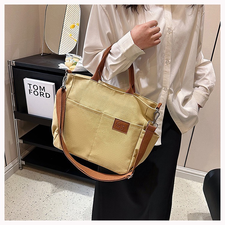 Bolso de lona con diseño de nicho, nuevo bolso tote de gran capacidad, bolso de hombro versátil para ir al trabajo, bolso informal para mujer