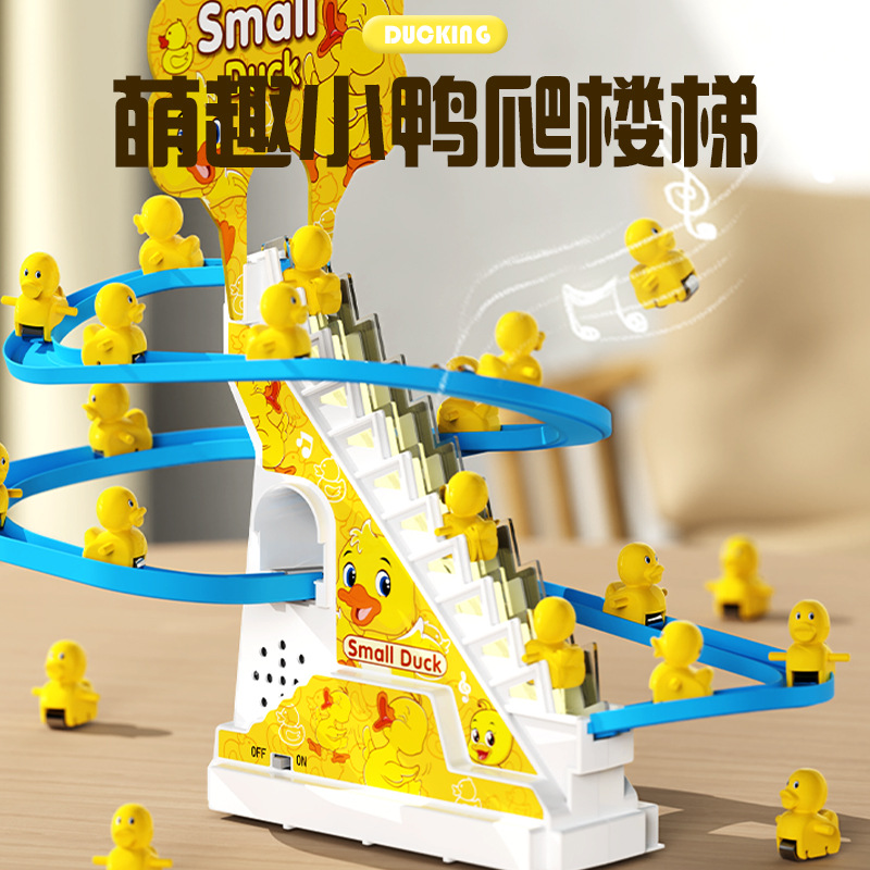 The same little yellow duck climbs the stairs, slides down the slide, and the electric duck track children's toy