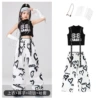 Black white vest, sleeves with tassels, trousers, necklace