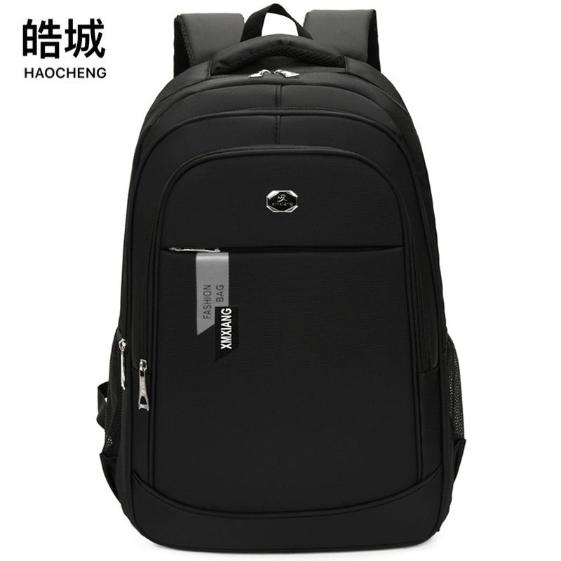 Mochila casual para hombres de nuevo estilo, mochila para computadora portátil de reducción de carga de negocios, mochila escolar para estudiantes de secundaria y preparatoria al por mayor