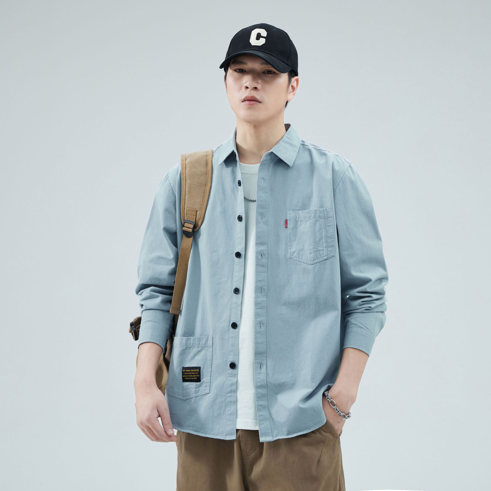 Camisas personalizadas de fábrica para hombres primavera y verano algodón de manga larga tendencia de ropa de estilo americano con solapa de bolsas de moda de ropa de estilo