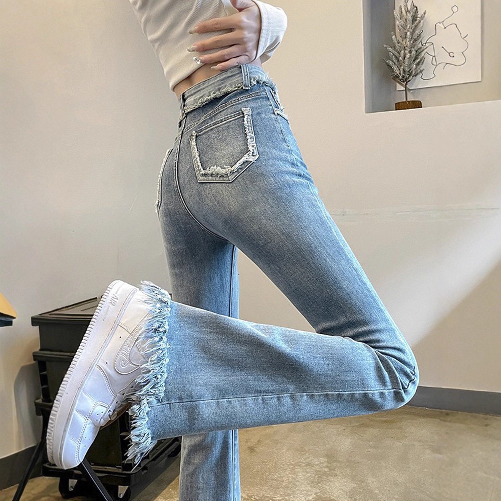 Light colored spring autumn flared trousers with tassels