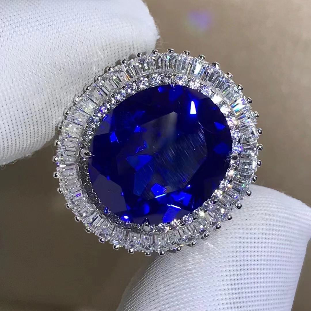 Comercio exterior transfronterizo exclusivo para anillo de zafiro sintético de alta calidad corte oval con incrustaciones de joyería de plata de 15 quilates