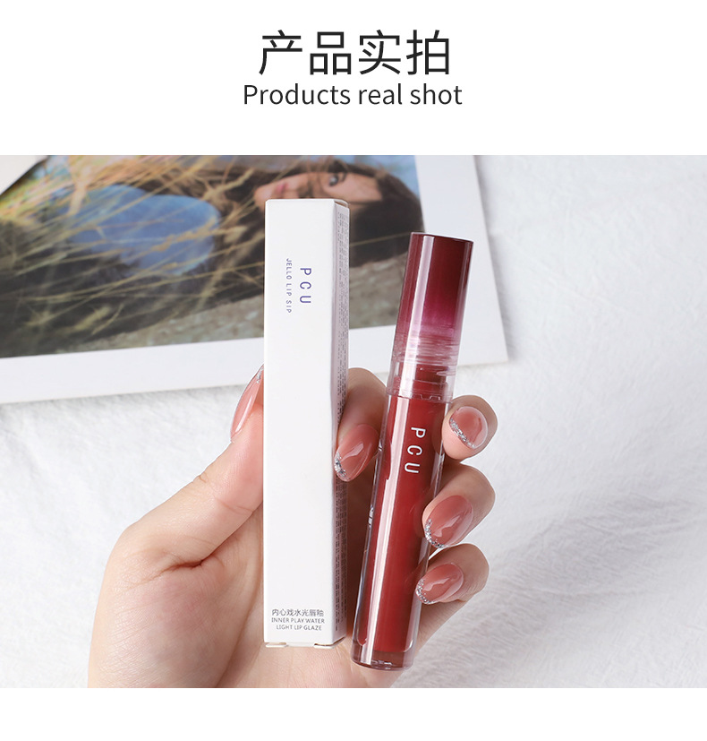 PCU Inner Drama Mirror Water Gloss Lip Gloss forms a long-lasting film without fading, providing a moist feel. It's a popular lip gloss undefined