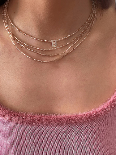 A handmade beaded shell letter lockchain necklace for women, featuring a minimalist and elegant style, inspired by Italian fashion influencers.