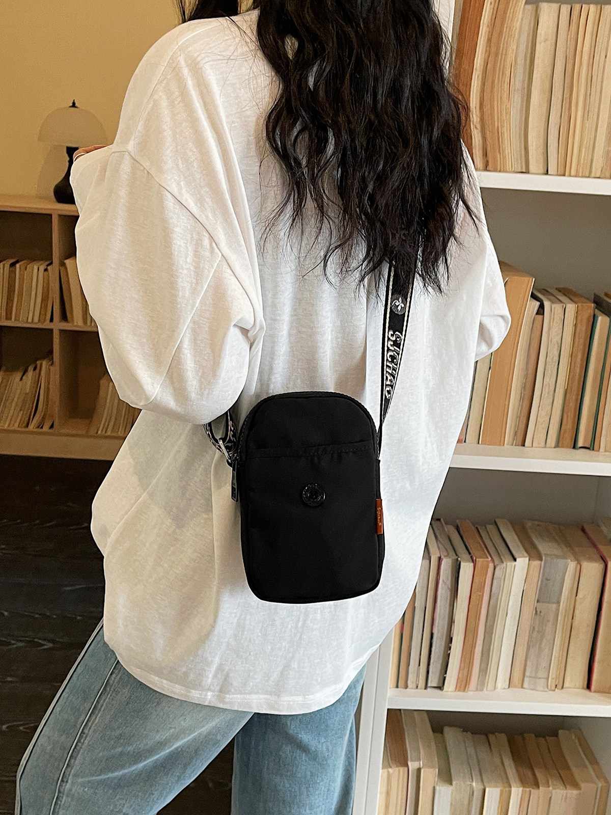 Bolso de nylon de moda para mujeres 2026 nuevo bolso de teléfono móvil ligero casual simple bolso de transporte de viaje
