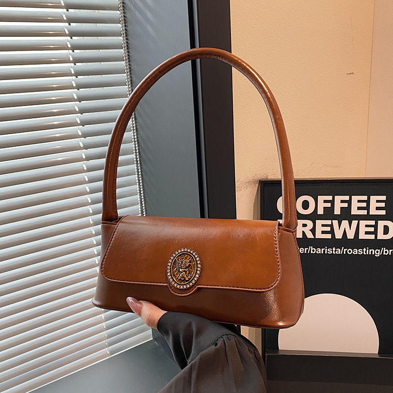 Bolsos retro de estilo extranjero para mujeres otoño y invierno 2024 nuevo estilo de moda bolsas de brazo de diseño de nicho bolsas de hombro