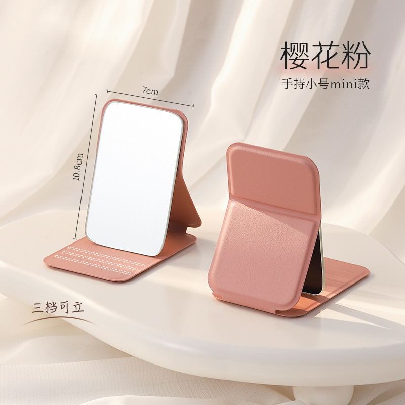 Espejo de maquillaje portátil de viaje de mujer plegable pequeño espejo de mano dormitorio de estudiantes espejo plegable mini espejo para hombre