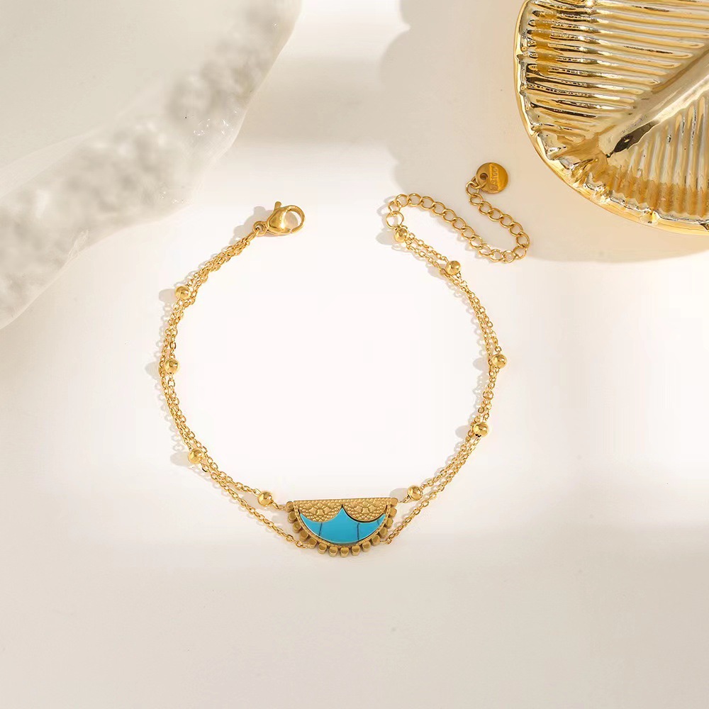 Pulsera de trébol de acero titanium vendedora caliente transfronteriza europea y americana con incrustaciones de concha pulsera colgante pulsera de diseño avanzado sin desvanecimiento al por mayor