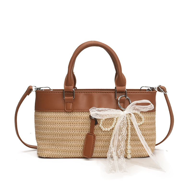 Bolso de vacaciones junto al mar 2025 verano nuevo bolso bolso de hombro de color de contraste tejido de paja bolso de mensajero de playa para mujer