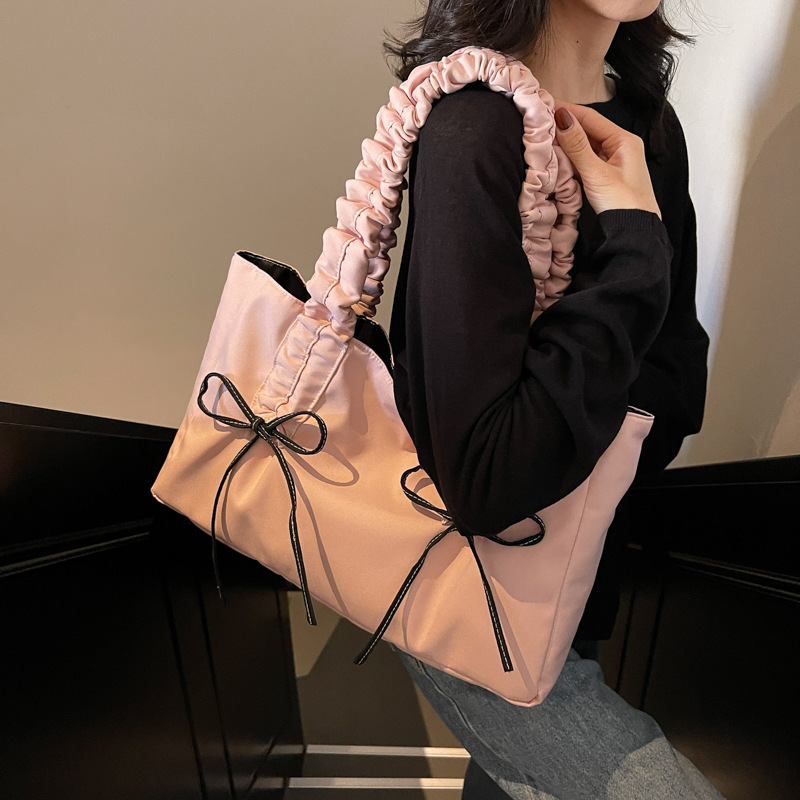 Bolsa de hombro de nicho coreano, bolso de viaje de arco, bolso de mano de mujer, bolso casual de gran capacidad, simple.