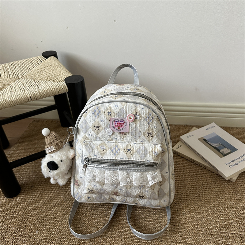 Mochila encantadora de moda coreana de mujer, alto valor de la cara, mochila de viaje diario, mochila universitaria universal.